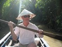 Tracy paddling the canoe somewhere in the Mekong Delta